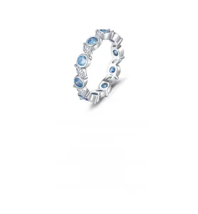 Detailed close-up of S925 sterling silver ring with blue gems and S925 engraving