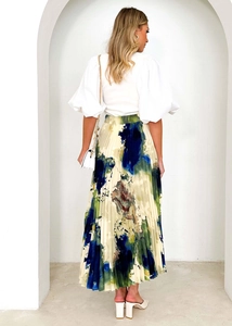 Rear view of long pleated midi skirt featuring green and blue abstract oil painting print