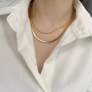 Double-layered gold titanium steel necklace featuring a snake chain and bead chain