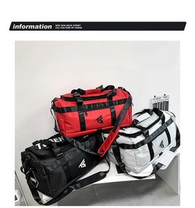 Close-up of three waterproof cylinder sports bags in red black and white with TS logo