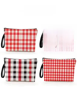 Detail showing four stylish checkered makeup bags with black zippers and carrying handles
