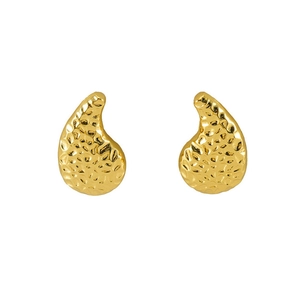 Detailed close-up of golden teardrop earrings with a hammered metal texture finish