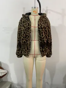Detail of leopard print faux fur hoodie jacket with metal zipper closure and black lining