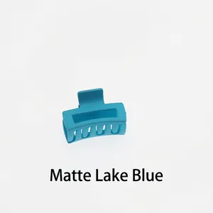 Detail of matte lake blue rectangular hollow hair claw clip with uniform grip teeth