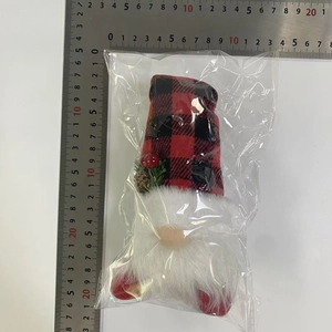 Size measurement of a light-up Christmas gnome with red plaid hat and pine cone detail