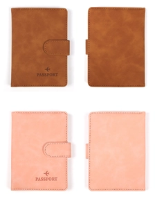 Detailed view of brown and pink passport covers with secure strap and airplane icon