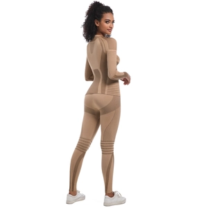 Detailed view of seamless beige athletic set with breathable knit texture and contouring