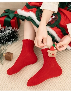Detailed view of red Christmas cotton socks for girls featuring a cute 3D reindeer design