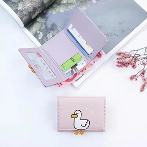 Detailed interior view of a cute cartoon duck trifold wallet showing cards and cash slots