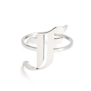 Detailed close-up of a silver polished open ring featuring a stylish cursive letter F design