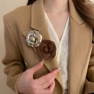 Elegant leather flocked and gold metal rose brooch set for stylish coats and blazers
