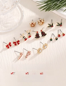 Detailed view of alloy Christmas stud earrings set featuring reindeer and snowflake designs
