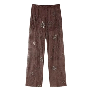 Pantalon large en maille marron avec broderie d'étoiles en sequins et strass argentés
