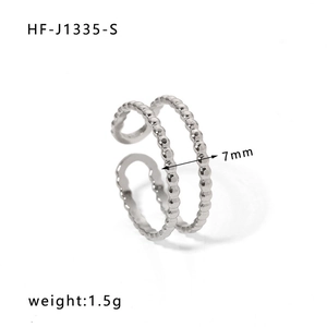 Detailed macro of 7mm width stainless steel double-layer beaded open ring texture