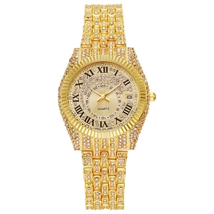 Detail of luxurious iced-out gold watch with crystal encrusted case and roman numerals
