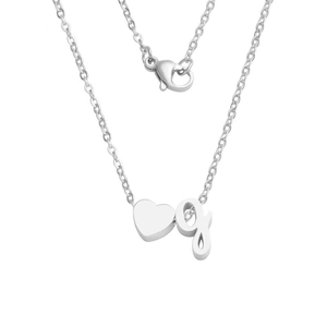 Detailed view of silver stainless steel necklace with heart and letter g charms