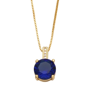 Close-up of golden necklace with a round dark blue zircon and small clear accent diamonds