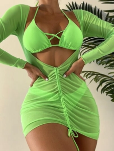 Detail of neon green beachwear with mesh drawstring dress and halter neck bikini