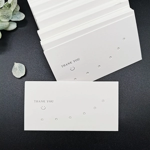 Cartellini per gioielli in cartone bianco con logo 'Thank You' e fori di esposizione multipli