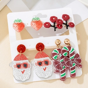 Christmas earring set featuring acrylic Santa, candy cane, and tree designs on a white card