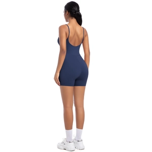 Detail of the deep blue athletic romper showing its thin straps and deep open back design