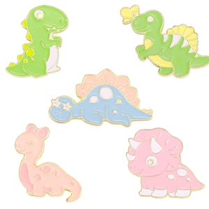 Set of 5 colorful enamel cartoon dinosaur brooches in green pink and blue with gold edges