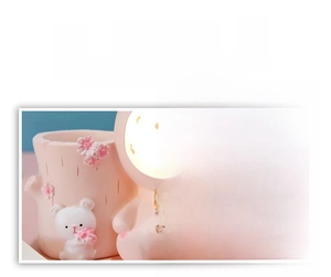 Close-up of pink resin pencil holder featuring hand-poured floral reliefs and star details