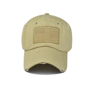 Detail of vintage washed khaki baseball cap with embroidered American flag patch