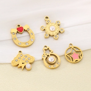 Collection of gold charms including horseshoe, snowflake, cloud and stars with pearls