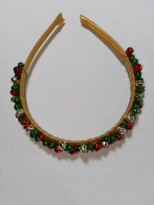 Festive Christmas headband with gold fabric and colorful jingle bells for holiday parties