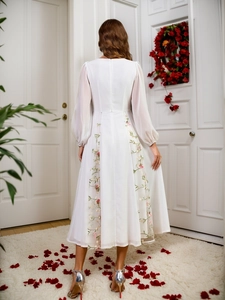 Elegantes weißes Kleid mit V-Ausschnitt, Puffärmeln, Blumenstickerei und halbdurchsichtigen Ärmeln