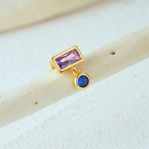 Detailed view of 16G silver cartilage stud with purple rectangle and blue round gems