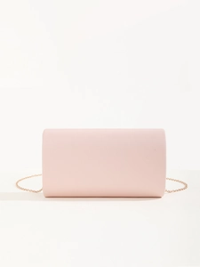 Detail view of pink PU leather clutch with elegant metal chain strap for wedding party