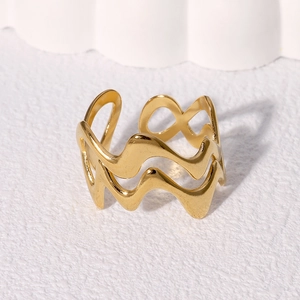 Polished warm gold stainless steel double-layer wavy open ring on white stone base