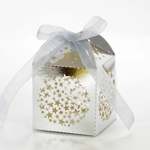 Detail view of silver star-shaped laser cut favor box with light blue organza ribbon bow
