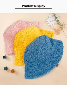 Flat lay of pink yellow and blue lamb wool bucket hats with textured fleece fabric