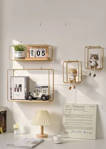 Detail of Nordic wall shelves with gold metal frames and wooden bases for home decor
