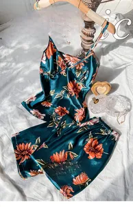 Detailed view of dark green floral silk-satin pajama set with V-neck top and shorts