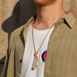 Hip hop gold scooter pendant necklace with full rhinestones on male model neck