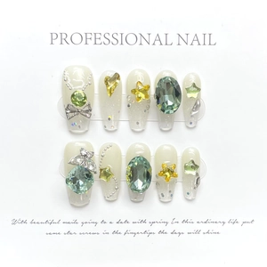Sparkling green gemstone press-on nails with butterflies and pearls on a white base