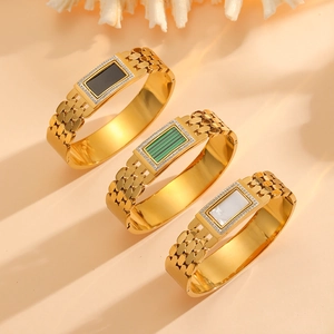 18K gold plated titanium bracelets with black, green, and white stone insets and diamonds