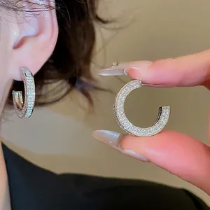 French style silver C-shape earrings with shimmering white zircons for a luxury look