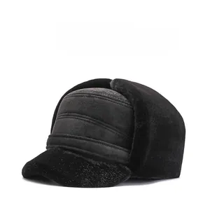 Close-up of black winter trapper hat with faux fur lining and plush ear flaps for men