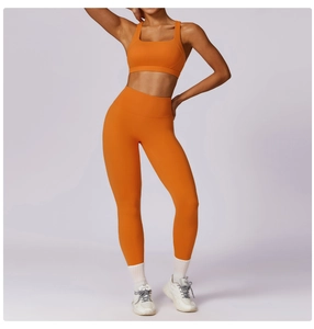 Orange high-waisted yoga set with U-neck sports bra and moisture-wicking fitness leggings