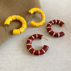 Retro C-shaped enamel hoop earrings in yellow and burgundy with gold stripe details