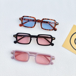 Detailed view of square frame sunglasses in leopard, black, and purple color options