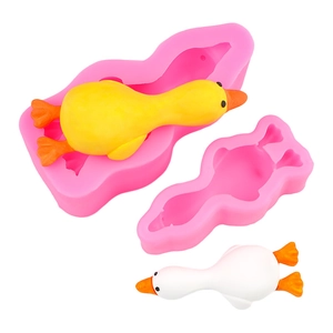 DIY silicone mold for duck-shaped cakes and chocolates with pink finish and white duck models
