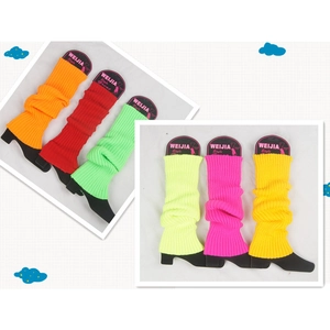 Colorful winter knitted leg warmers in vibrant orange red green and yellow shades