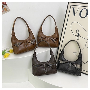 Detailed close-up of retro PU leather shoulder bags with unique shirt collar button design