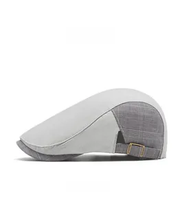Detailed side view of grey plaid ivy cap showing the adjustable bronze metal buckle